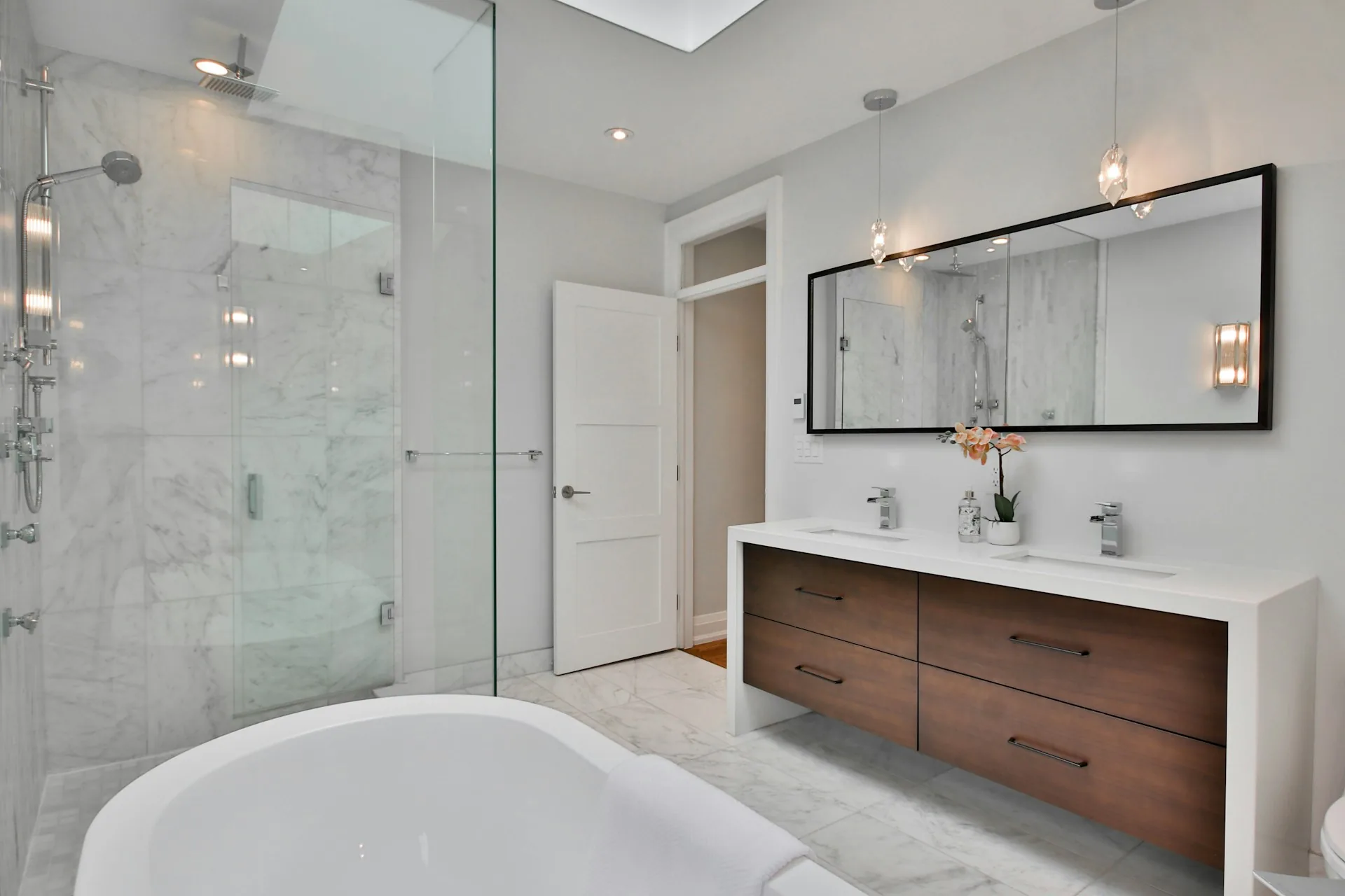 Marble shower and floating double vanity