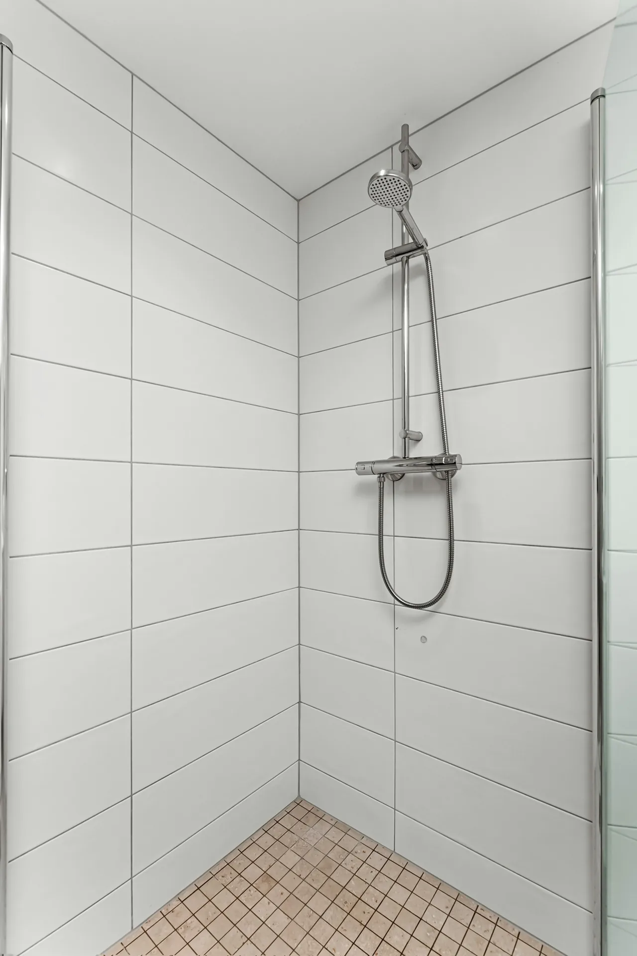 Large-format shower wall tile
